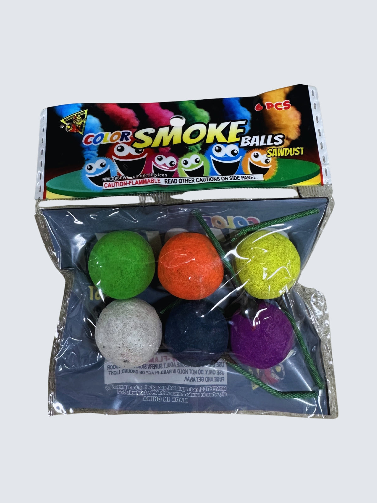 Color Smoke Balls 6-piece pack featuring assorted green, orange, yellow, white, blue, and purple sawdust smoke balls.