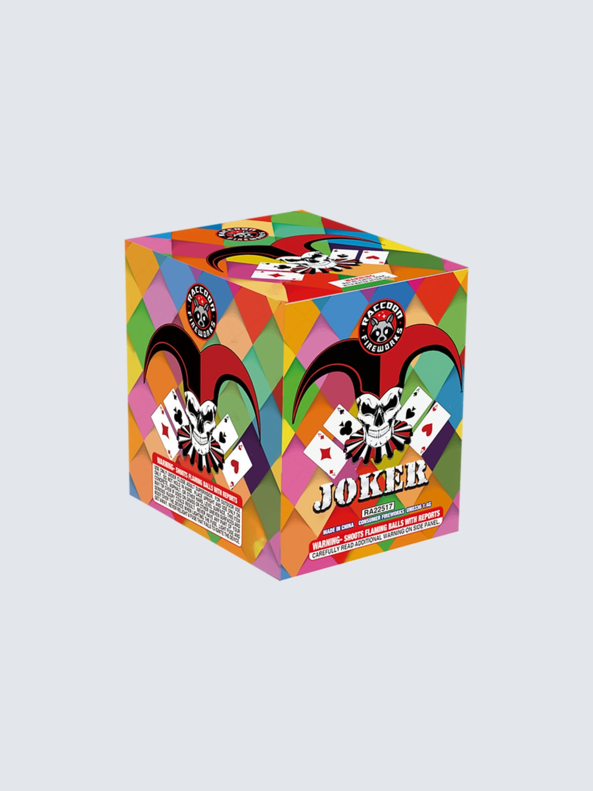 Joker aerial repeater by Raccoon Fireworks with a skull jester, playing cards and colorful diamond-pattern packaging.